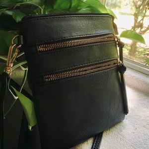 Small black zippered crossbody bag